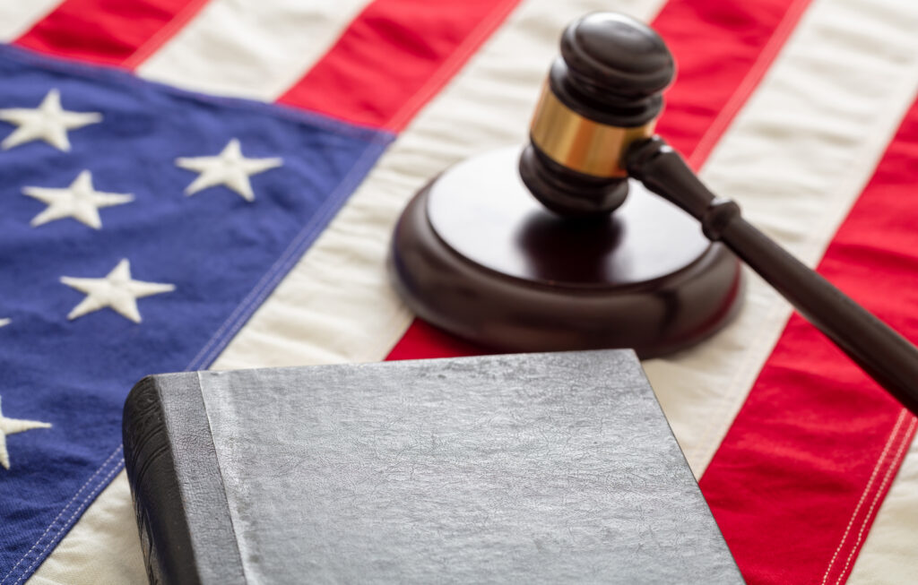 Law gavel and book on United States of America flag.