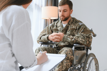 depressed-guy-in-camouflage-uniform-paralyzed-sold