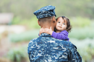 veteran holding a baby